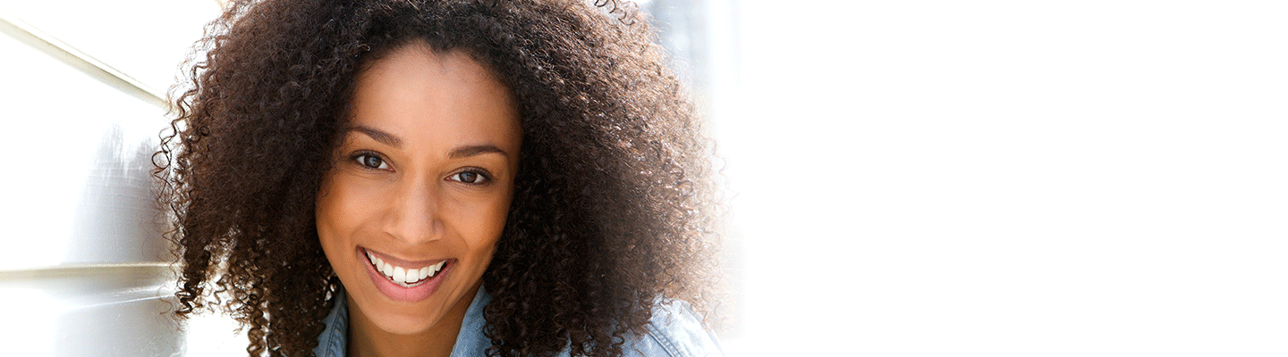 woman smiling with affordable dental implants