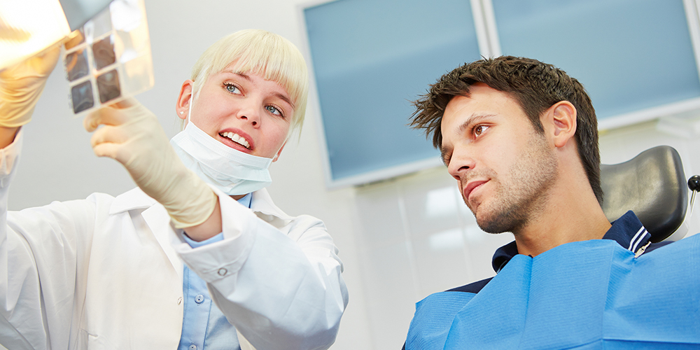 man visiting the dentist